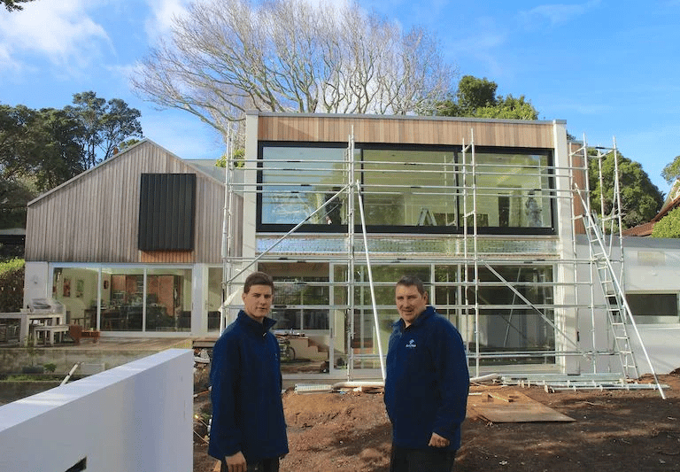 Builders working on house