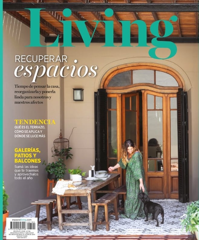 a woman sitting at a table with a dog