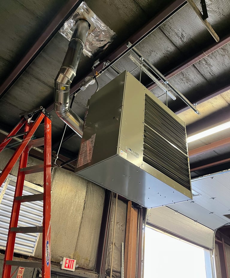 Ceiling mounted unit at an industrial building in Fond du Lac, WI helps ventilate this shop.