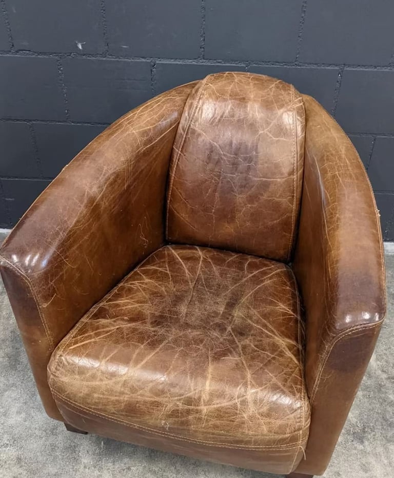 vintage leather armchair with a worn and distressed finish