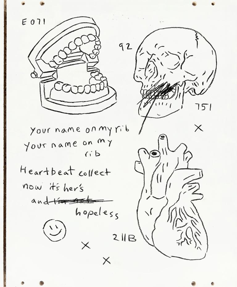 Rough painting on wooden board of a skull teeth a heart a smiley face cryptic text and codes