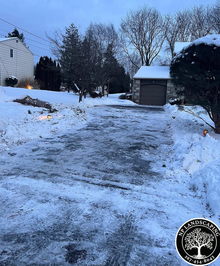 excellent landscaping and hardscaping of grass, stones and trees by NP Landscaping