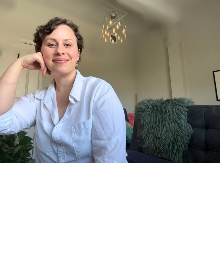a woman in a white shirt and a black couch
