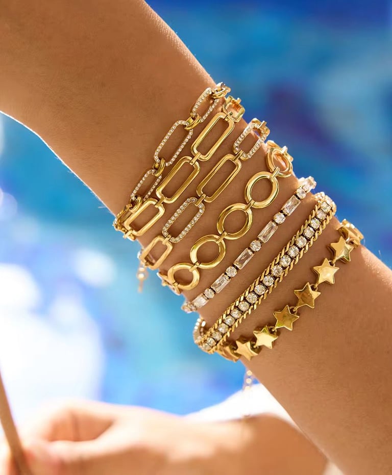 18 k gold plated Demi fine stacked bracelets which are water resistant and hypoallergenic.