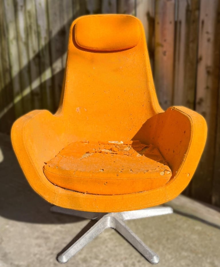 vintage Ikea 'Karlstad' chair in orange wool with many holes and foam damage