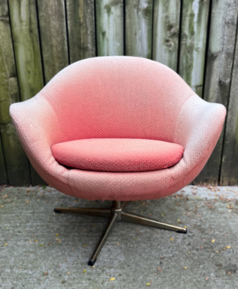 vintage Overman style egg chair with faded fabric and rusted legs