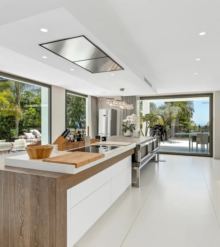 Modern white kitchen with island at Villa Serenity