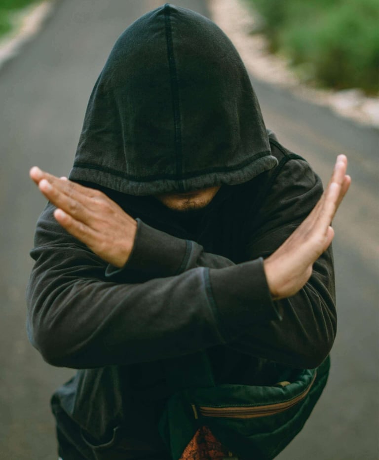 a person wearing a black jacket and a backpack