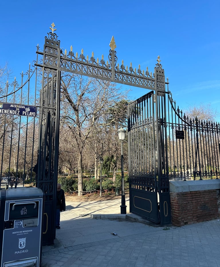 wrought-iron gates at the entrance to Retiro Park