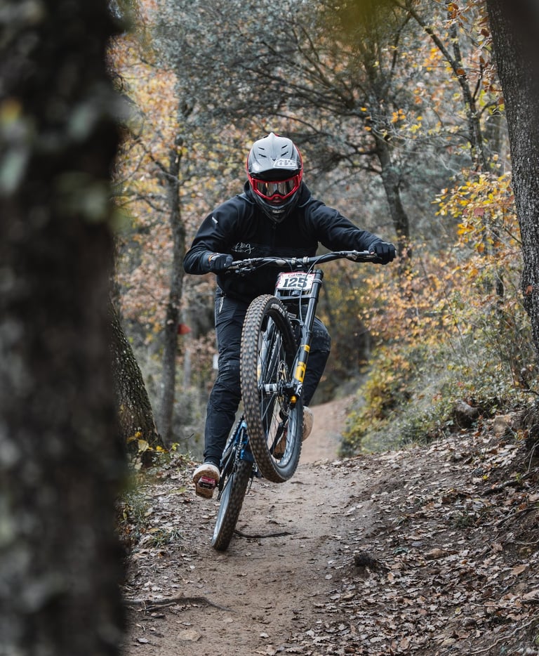 a man riding a bike down a trail