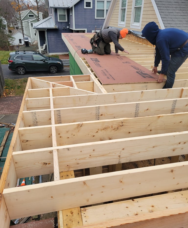 A man working on a new construction deck