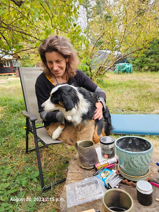 Me and Willow in her yard with my dog Zoe in her lap.
