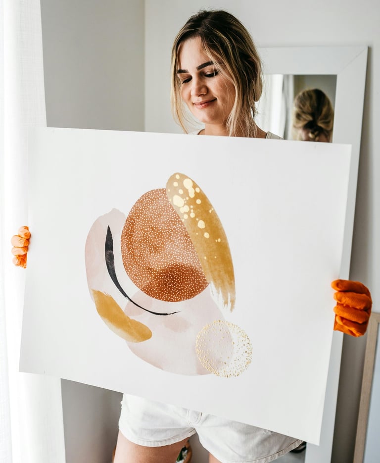 Artist presenting donated painting to gallery staff.