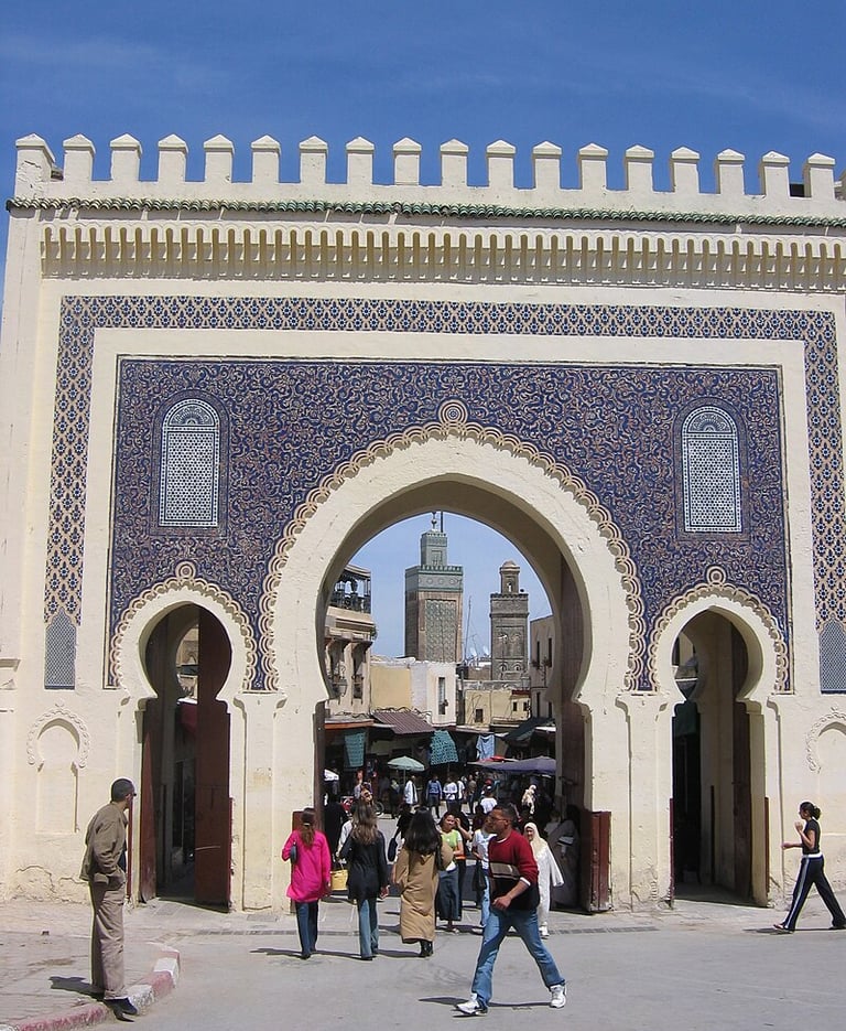 morocco fes a group of people walking through a building