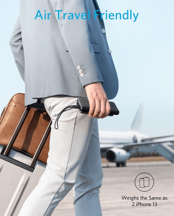 Traveler using a portable travel Anker PowerCore charger
