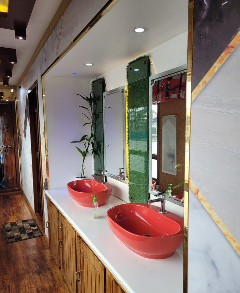 a bathroom with two sinks and a mirror