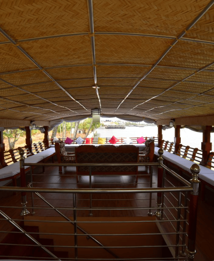 a boat with a table and chairs in the water