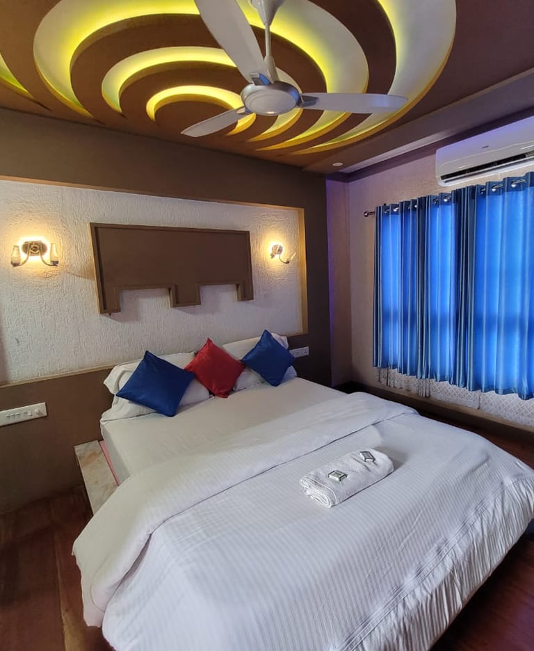 a bed room with a bed and a ceiling fan