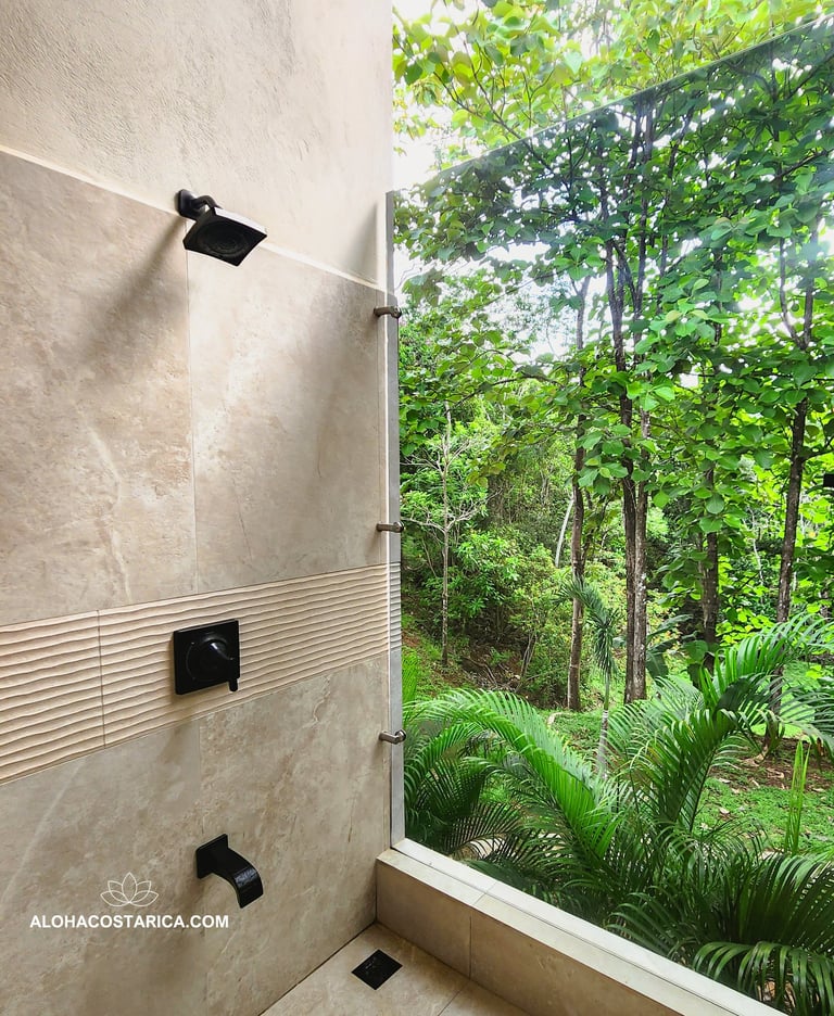 a bathroom with a shower and a shower