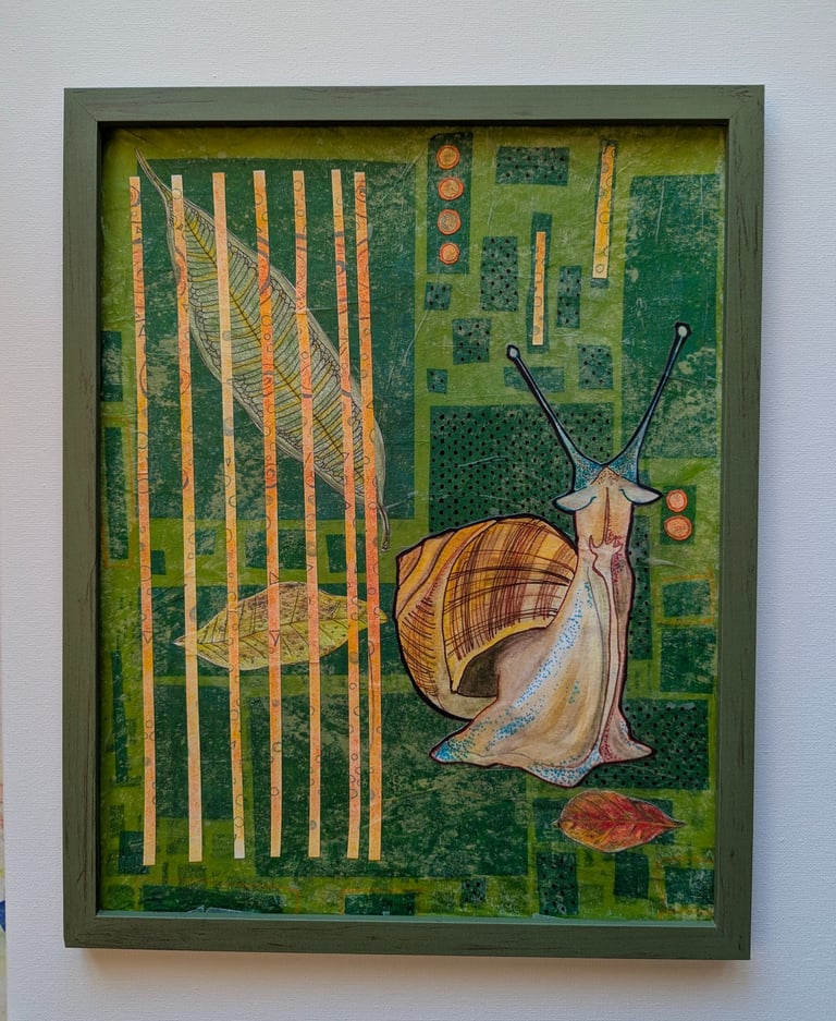 Green and orange playful mid-mod art of a helix snail in a green frame by Kathy LaFollett.