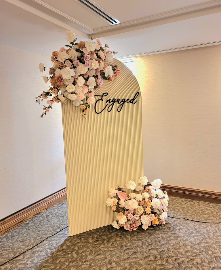 engagement party backdrop with a beige backdrop 