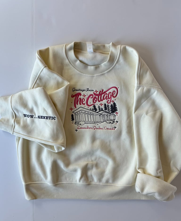 Photo shows a cream-colored sweatshirt with an embroidered house on it from Heated Rivalry.