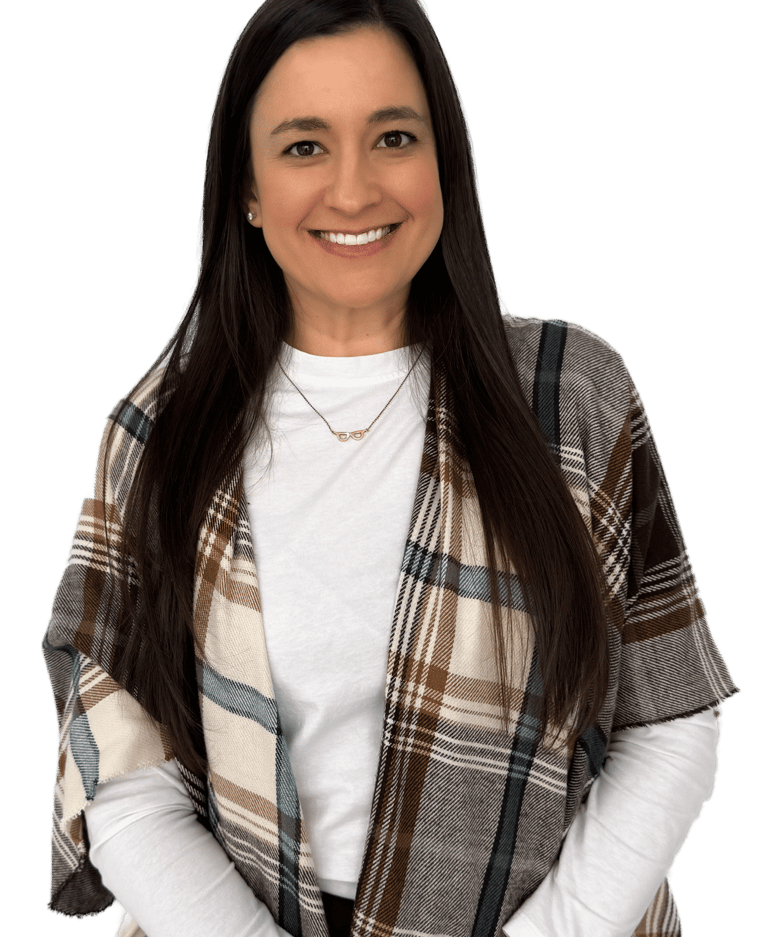 woman with long dark hair wearing a a white shirt and plaid scarf