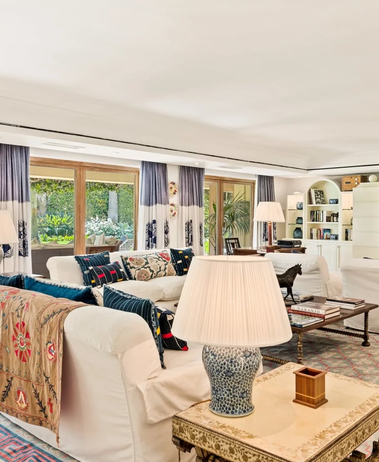 Spacious living room opening to garden in Marbella villa