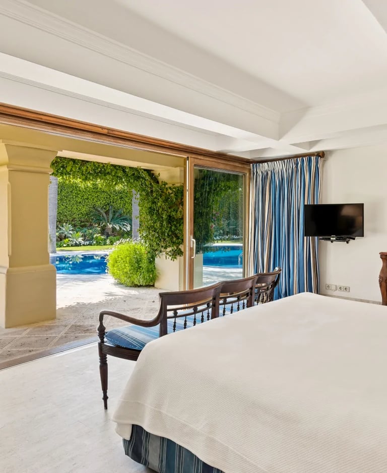Garden-view bedroom with terrace access in Marbella villa