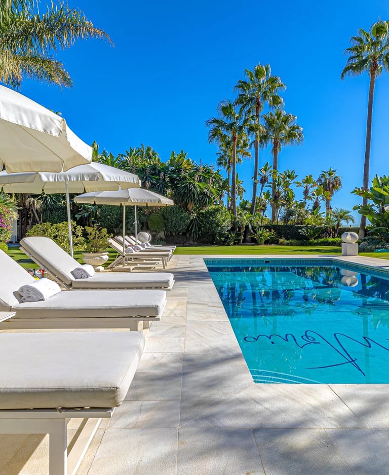 Sun loungers by private pool in luxury Marbella villa near Puerto Banus