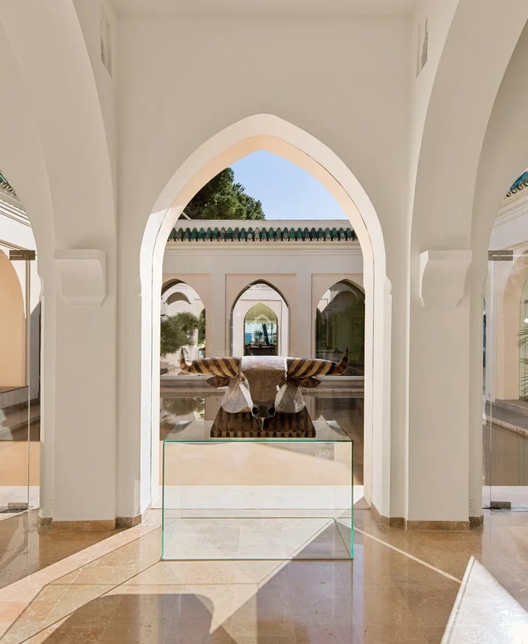Central courtyard with arched galleries and sculptural art display