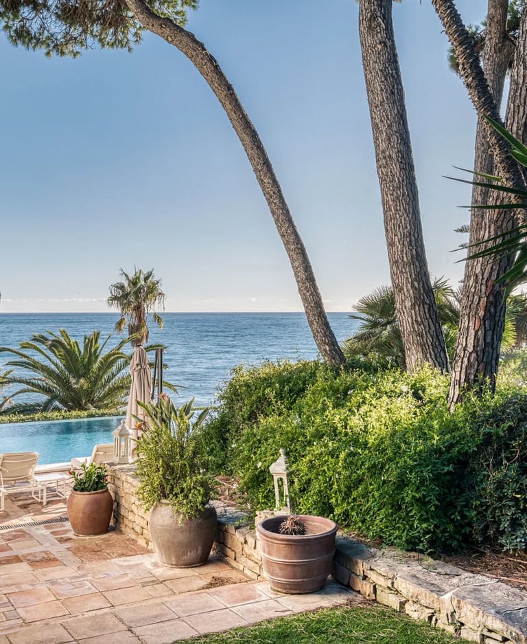 Pool terrace with sun loungers overlooking the Mediterranean