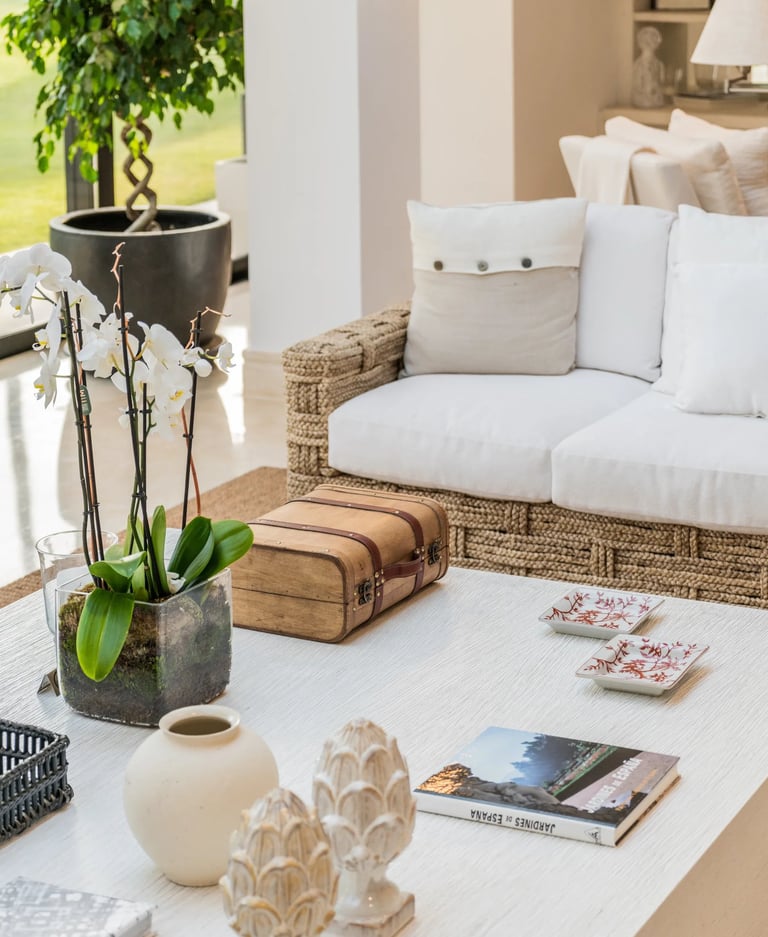 Styled coffee table with orchid and decor accents