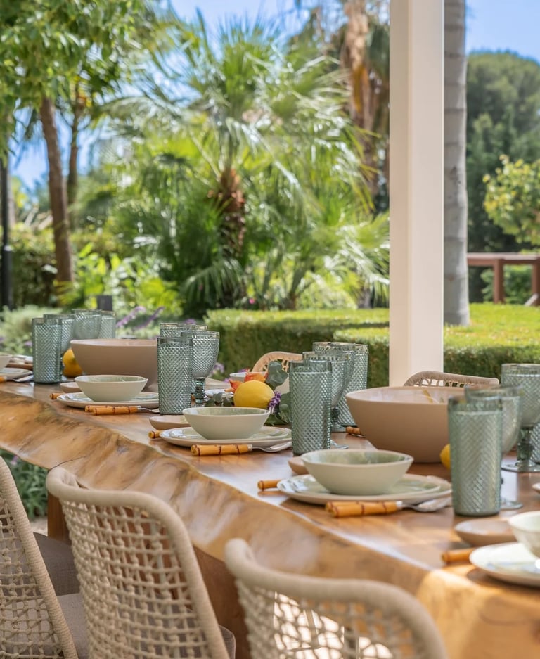 Rustic outdoor table set with green glassware