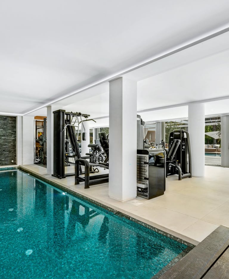 Indoor swimming pool located next to the home gym
