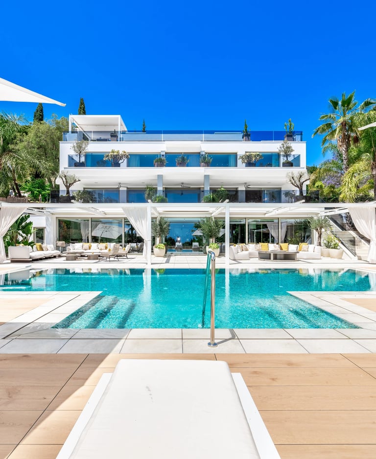 Rear view of the villa facade overlooking a luxury pool deck