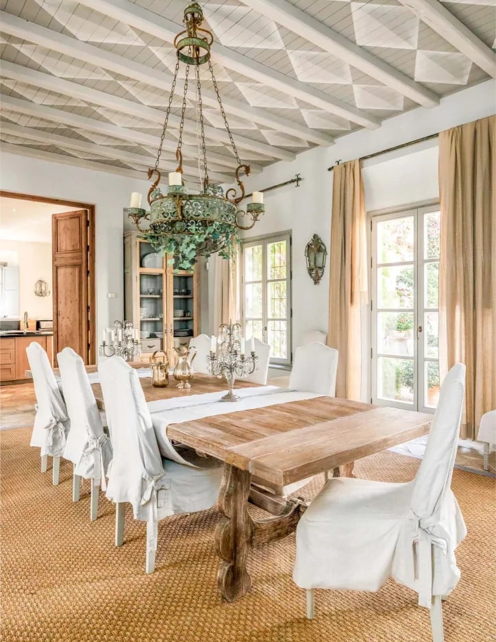 Bright dining room with wooden table and coffered ceiling