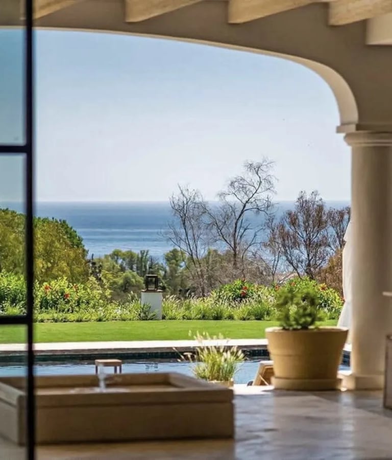 Covered terrace with pool and sea views