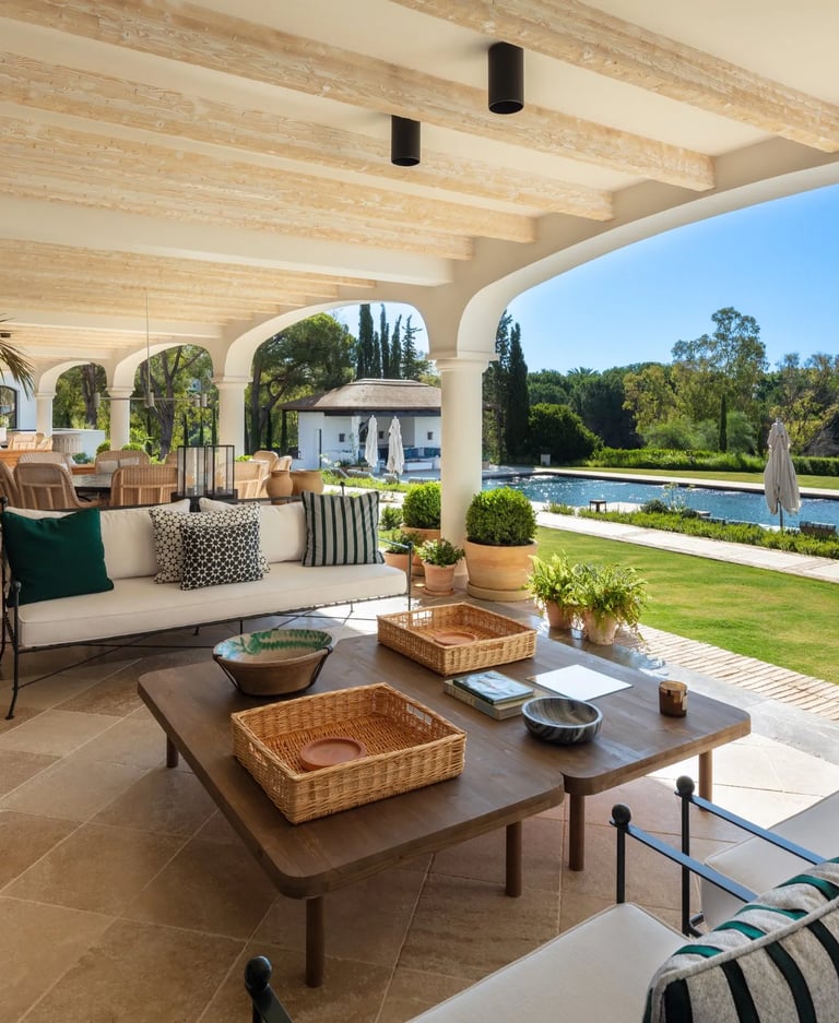Shaded terrace lounge overlooking the pool