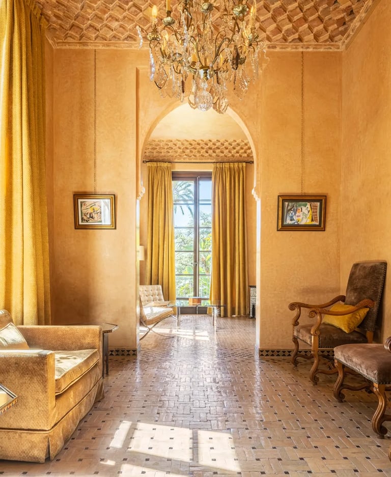 Sunlit entrance hall with carved ceiling and crystal chandelier