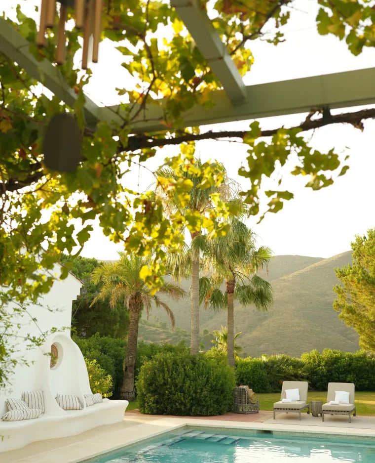 Private pool terrace with mountain views and shaded pergola