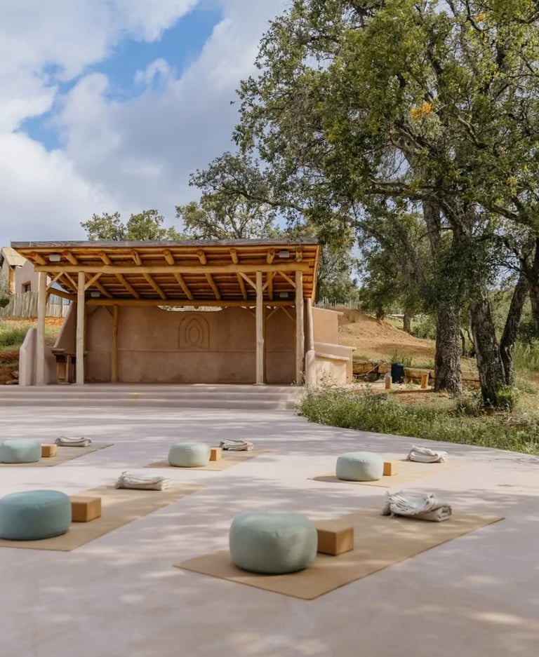 Outdoor yoga shala surrounded by trees and countryside