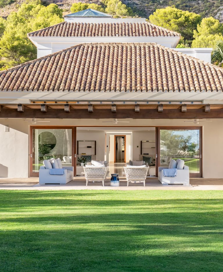 Covered terrace lounge with sliding glass doors