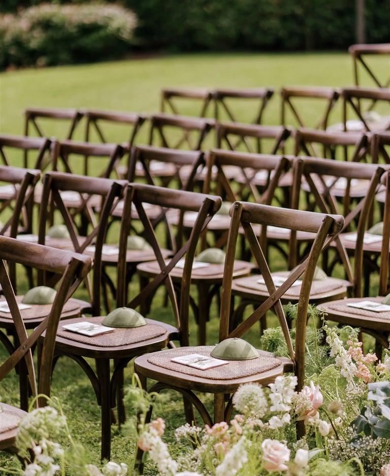 Wooden ceremony chairs with floral aisle details