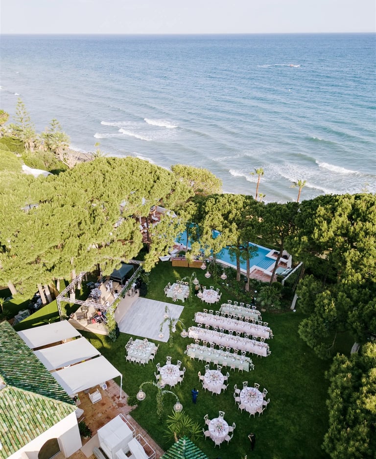 Aerial view of beachfront wedding reception in Marbella