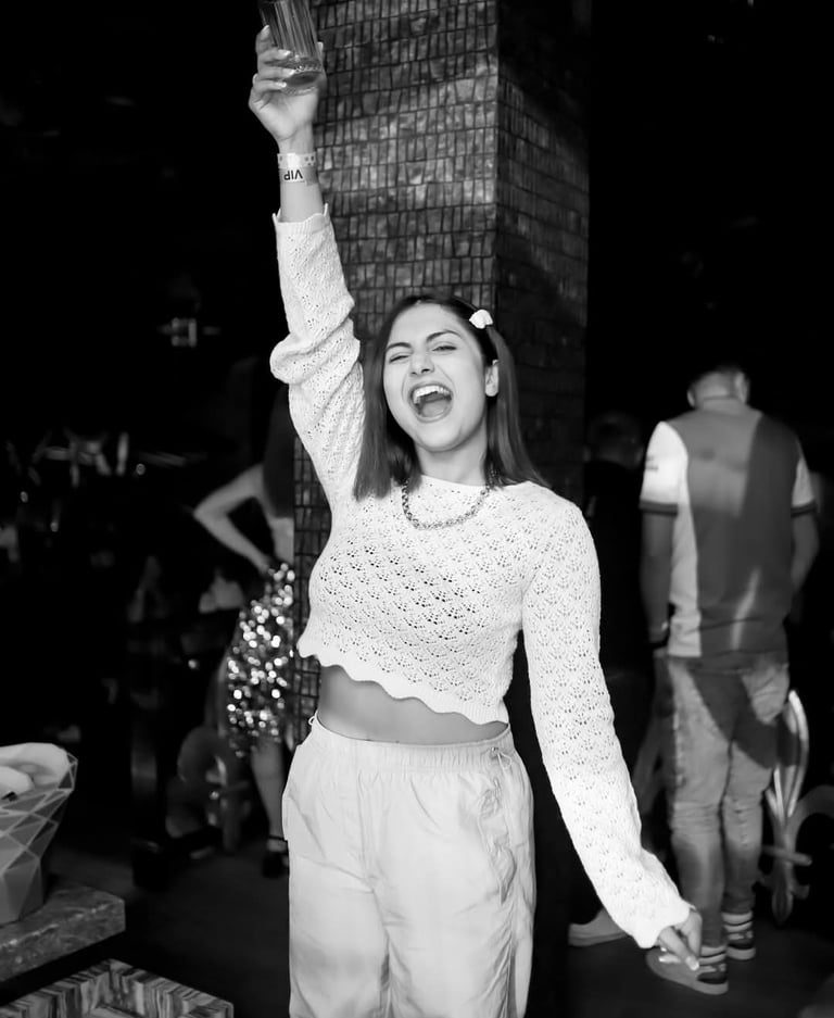 a woman in a white sweater and pants with a white sweater