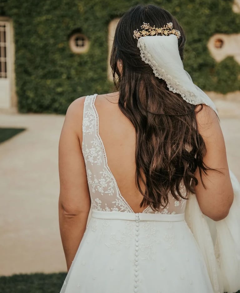 Bride wearing hair accessory and white veil styled by letshair