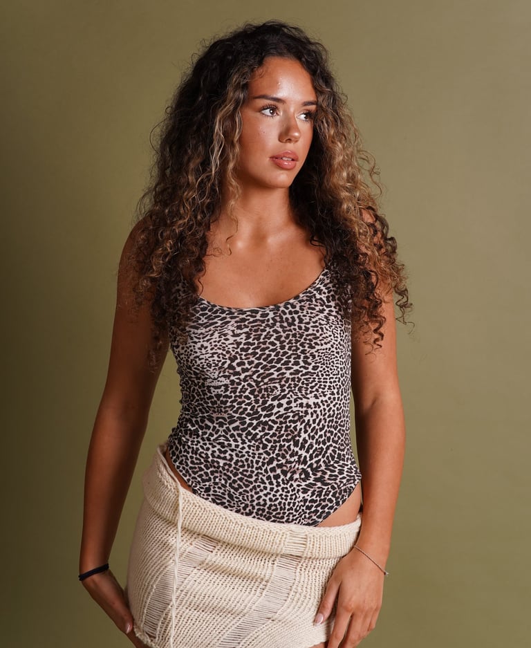 A model in a leopard print top