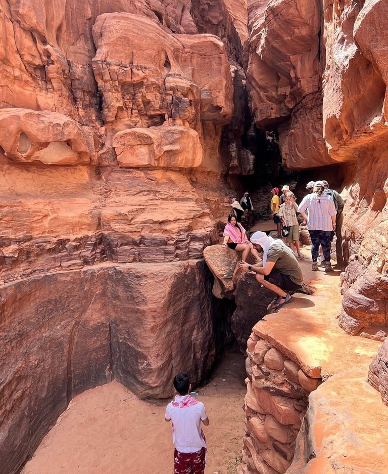 a group of people standing in a canyon