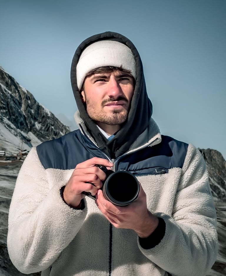 a man in a white jacket and a camera